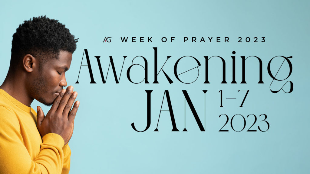 Week of Prayer January 1-7 - Man in yellow with hands folded in prayer